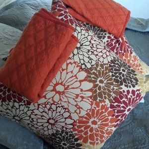 2 red pillow cases and two printed cushions